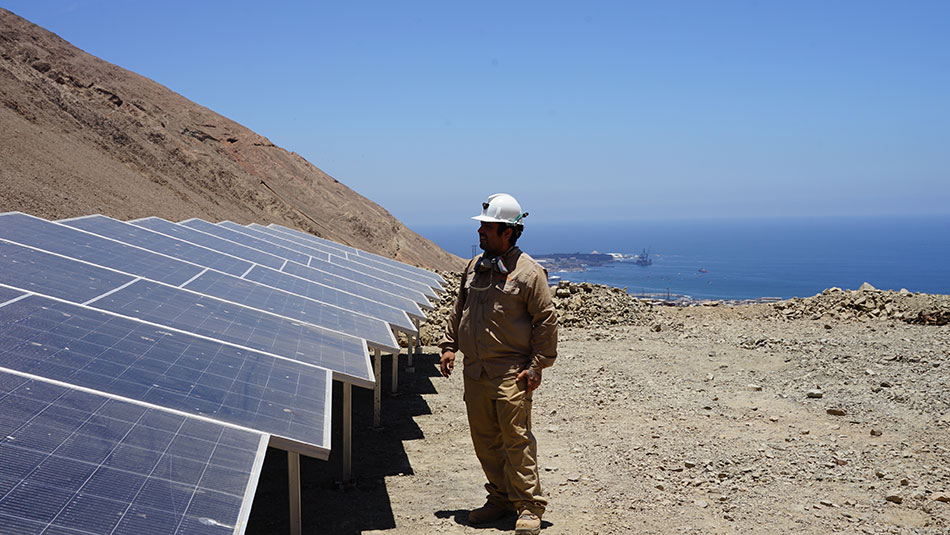 Rodrigo Bustamante, an independent miner in Tocopilla, Chile near El Abra, inspects solar panels built to provide power to independent miners in the region.