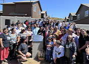 Local families gathered with mining industry and government representatives to dedicate new houses for families of two small communities devastated by forest fires last year.
