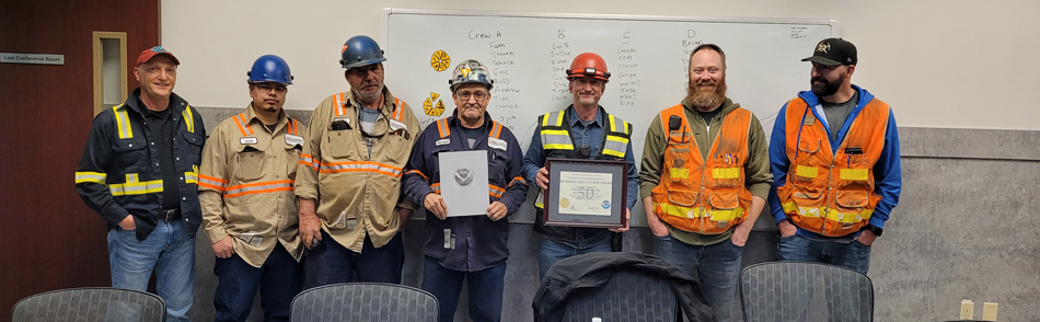 Climax General Manager John Wilmot (left) and Aaron Davis (second from right) received the award alongside some of the employees who have helped collect the data.