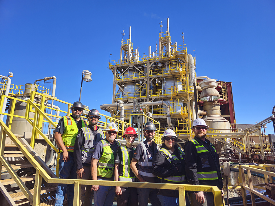 Alex Banda (second from right) and her colleagues stand in front of the completed concentrate leach plant expansion at Morenci.